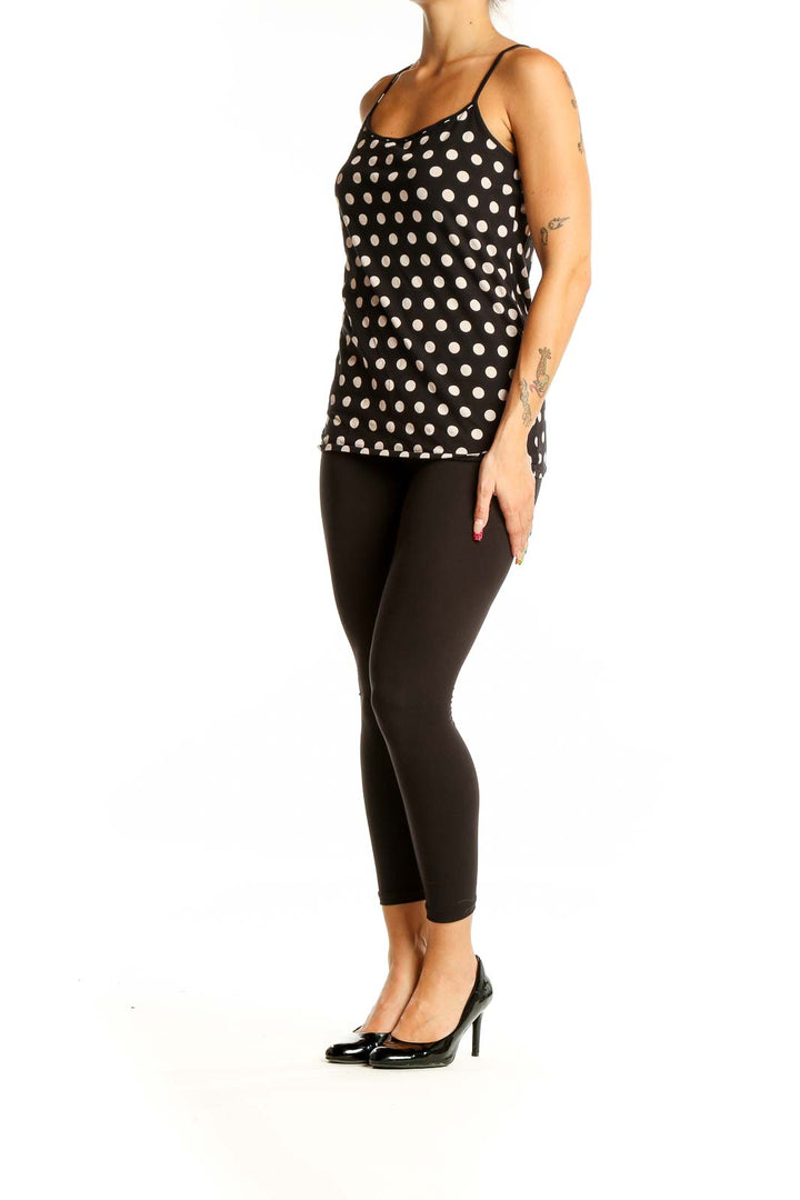 Front view of LOFT black and white polka dot camisole