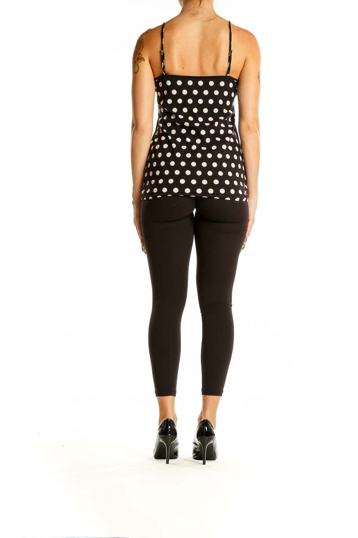 Back view of LOFT black and white polka dot camisole with adjustable straps