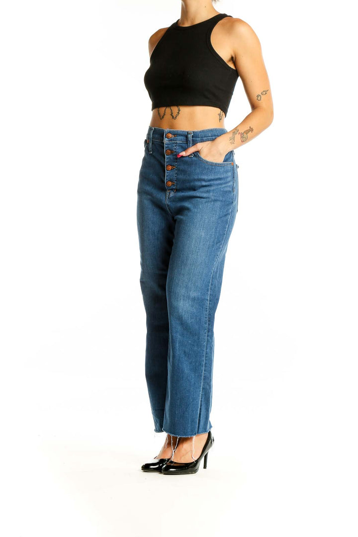 Front view of Madewell blue high-waisted wide-leg jeans with button-fly