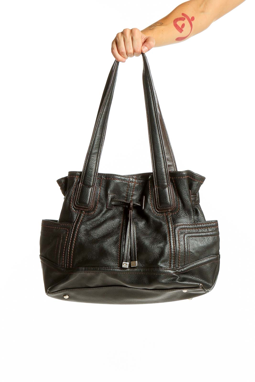 Front view of black leather Tignanello shoulder bag with drawstring closure