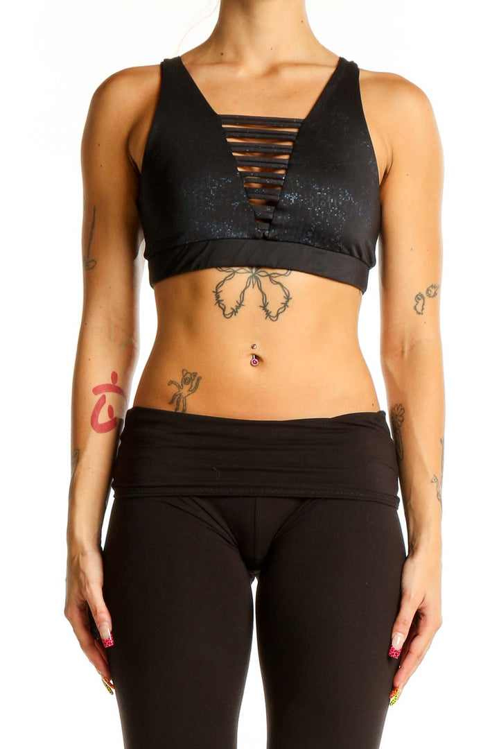 Front view of black sparkle Lululemon x Peloton sports bra with strappy design