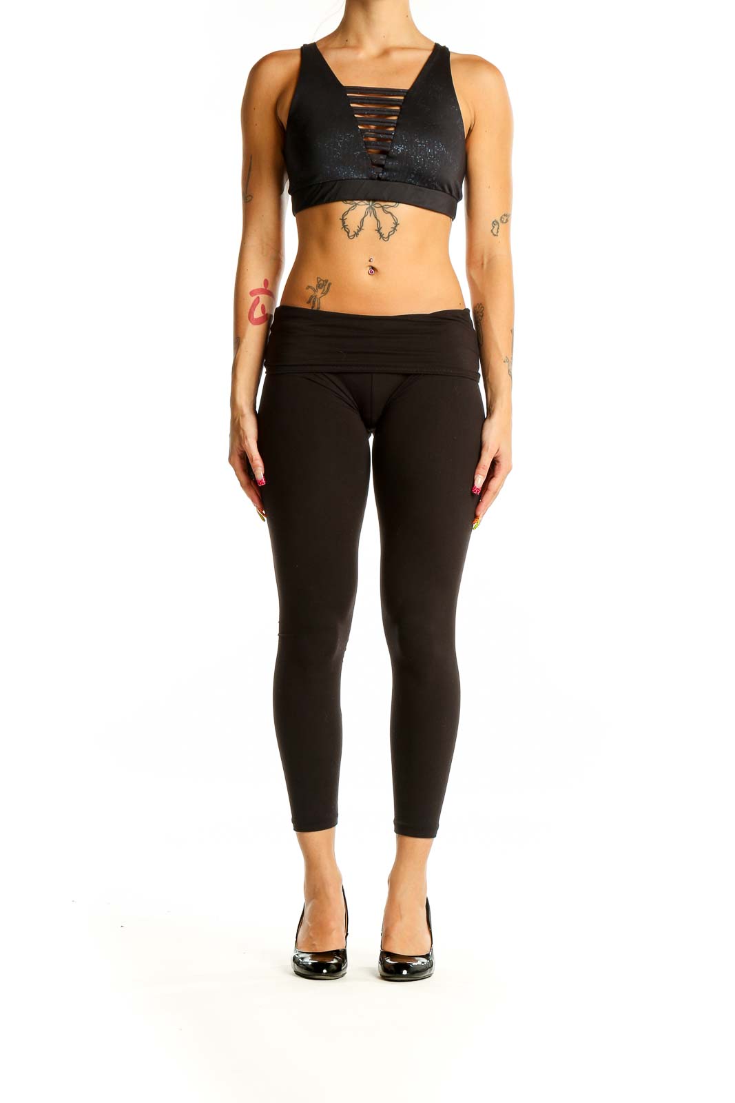 Front view of black sparkle Lululemon x Peloton sports bra with strappy design