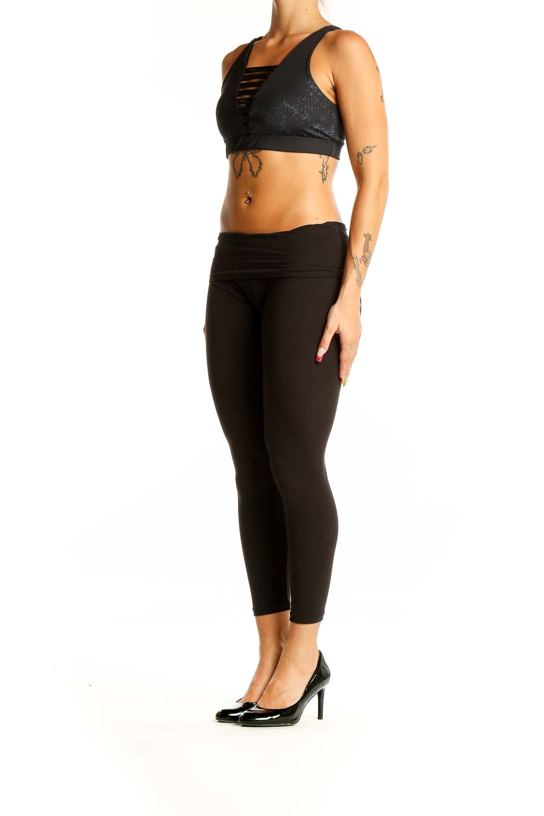 Front view of black sparkle Lululemon x Peloton sports bra with strappy design