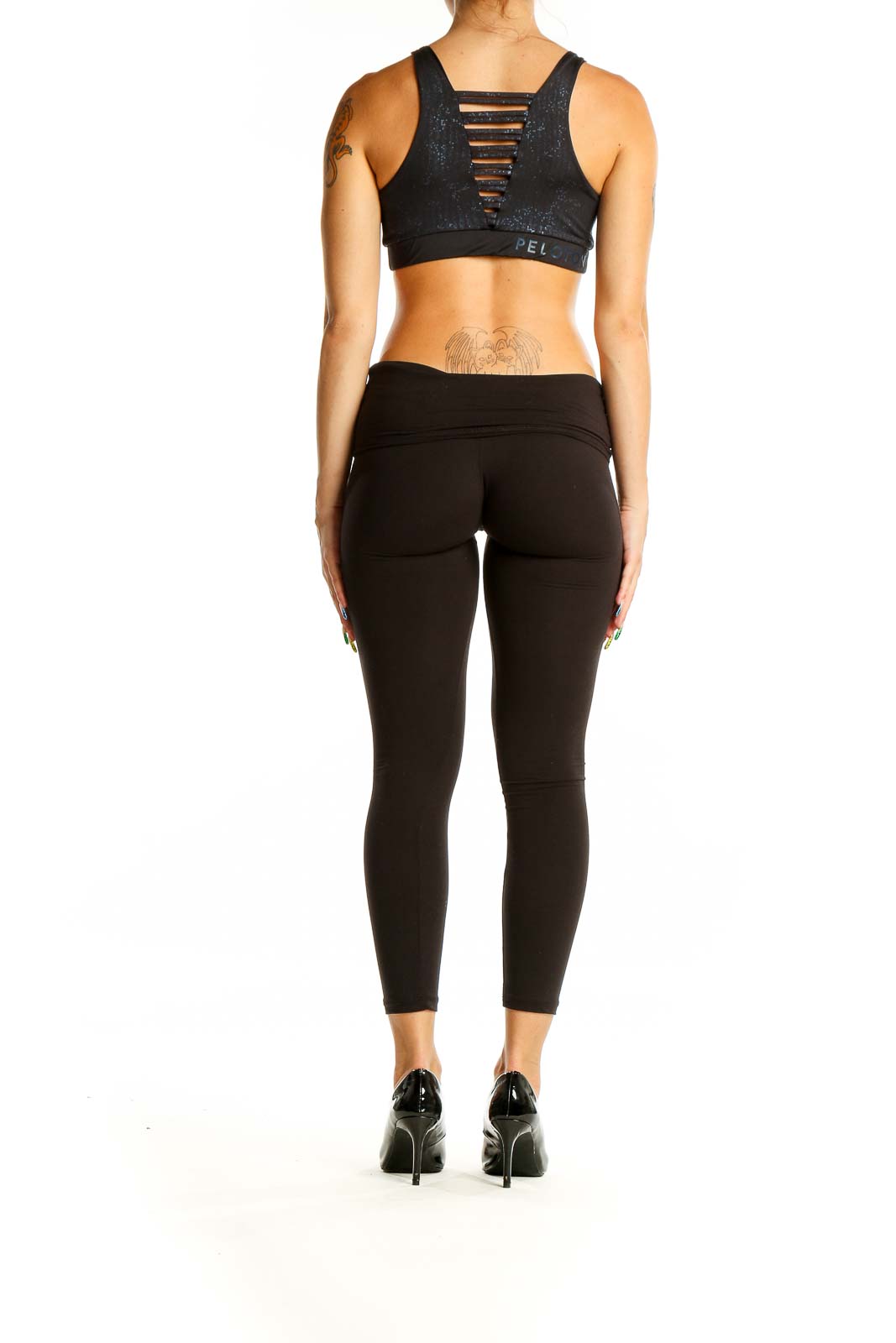 Back view of black sparkle Lululemon x Peloton sports bra showing racerback design