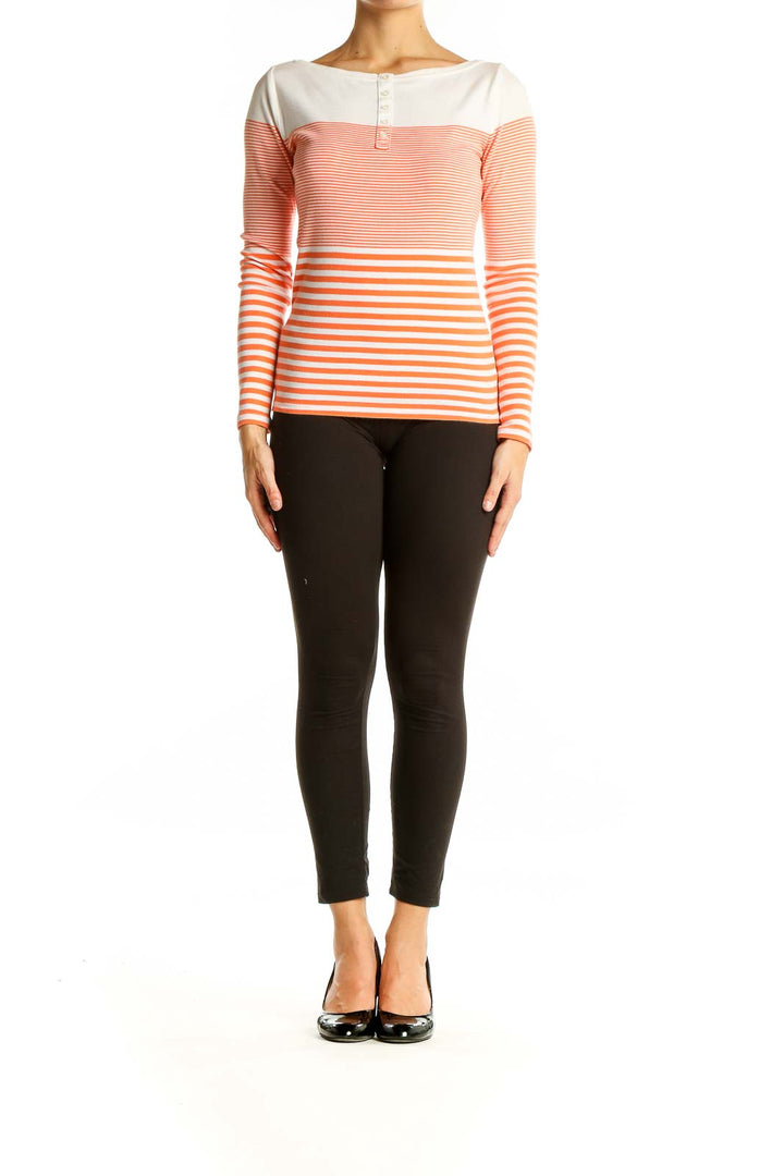 Front view of Ann Taylor orange and white striped long sleeve cotton top with henley neckline