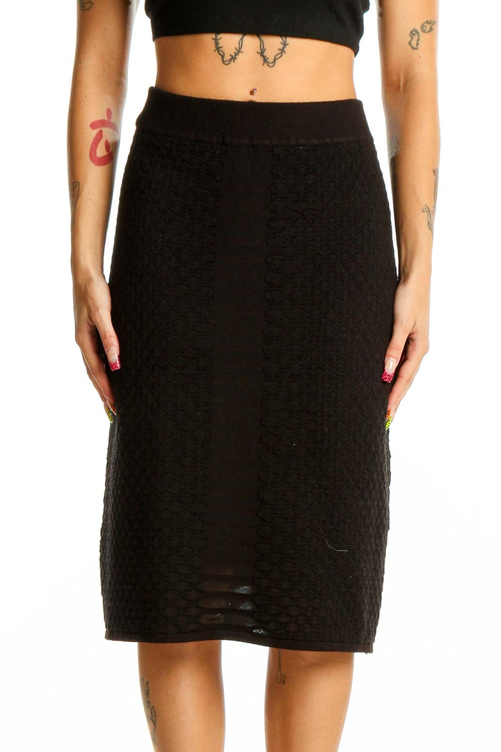 Front view of Calvin Klein black textured midi skirt on model