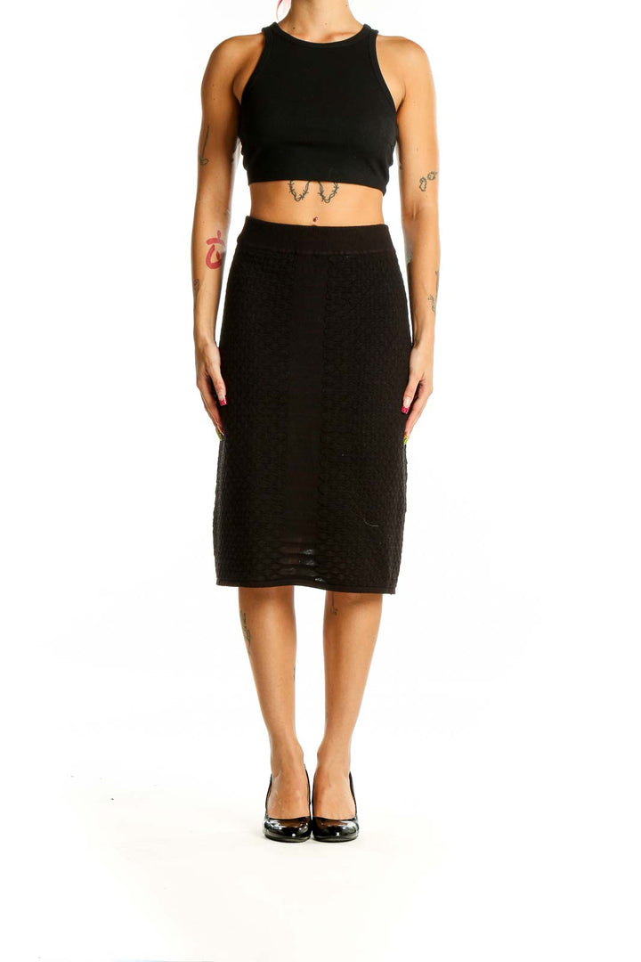 Front view of Calvin Klein black textured midi skirt on model