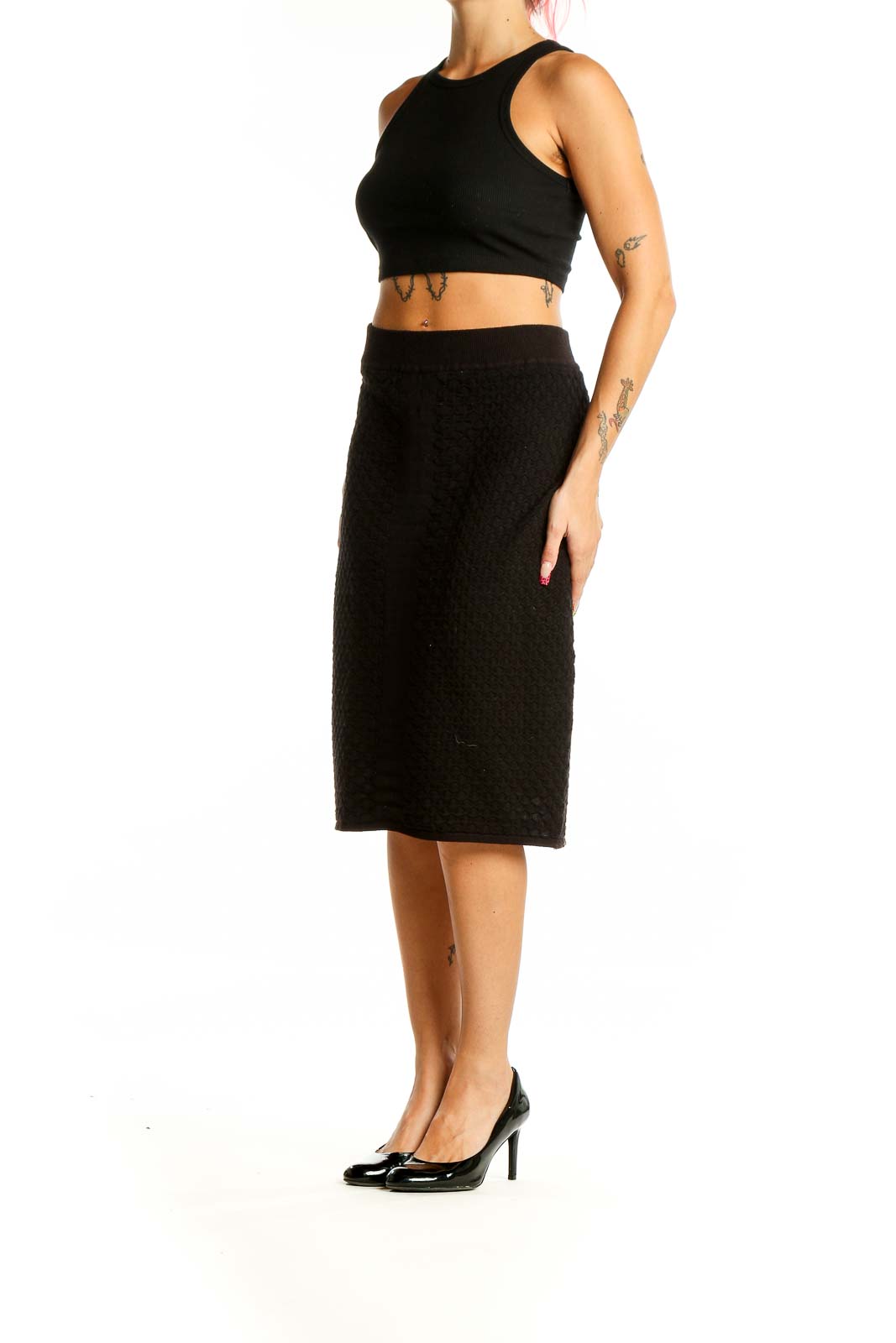 Front view of Calvin Klein black textured midi skirt on model