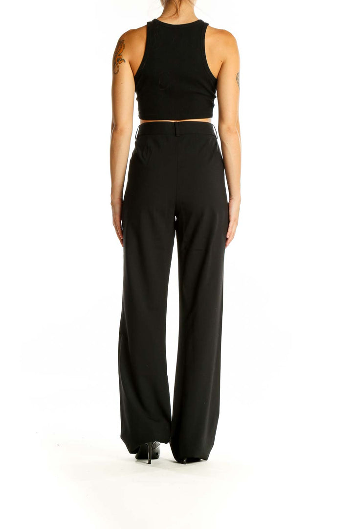 Back view of Diane von Furstenberg black wide-leg trousers on model