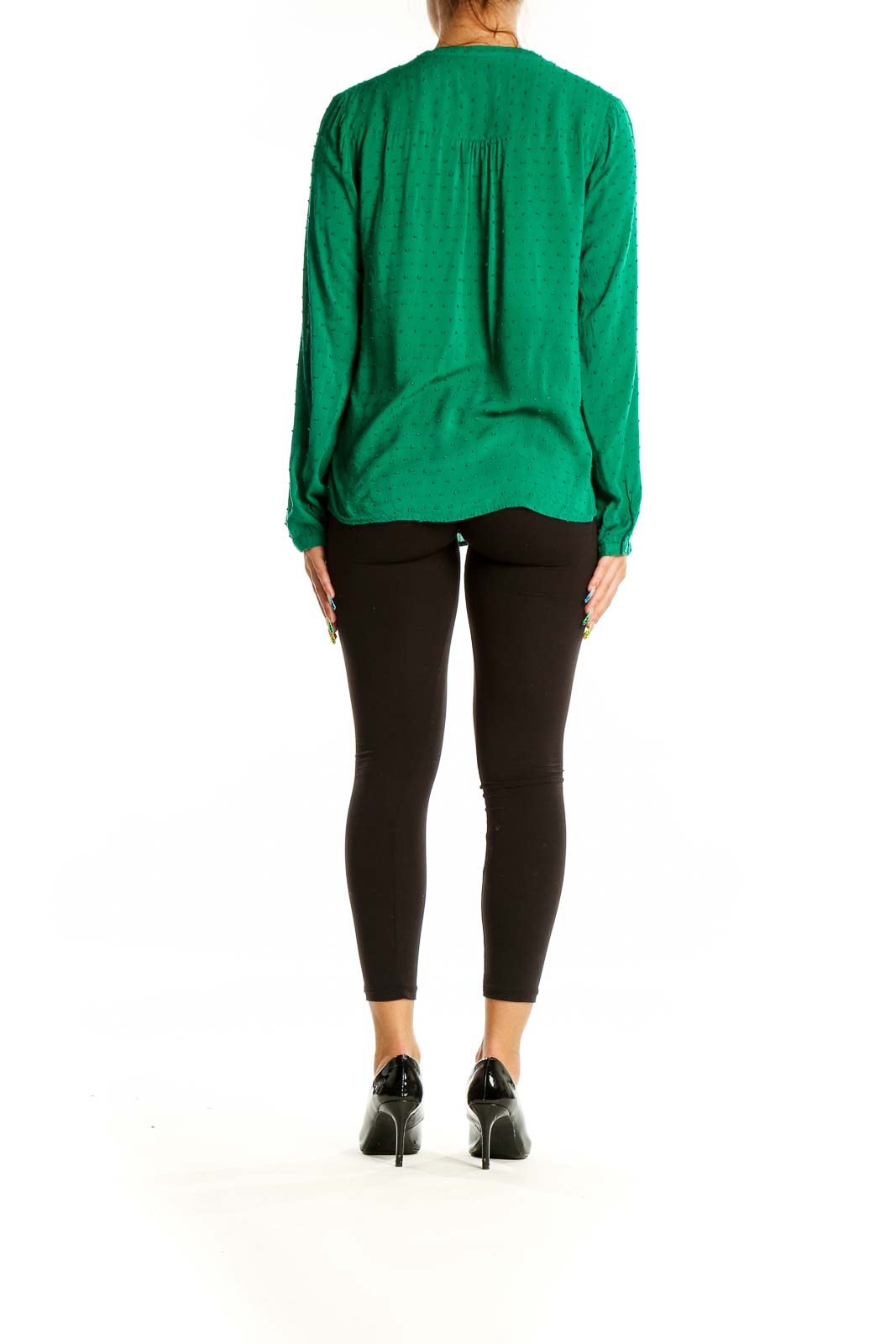 Back view of green rayon blouse showing relaxed fit and long sleeves