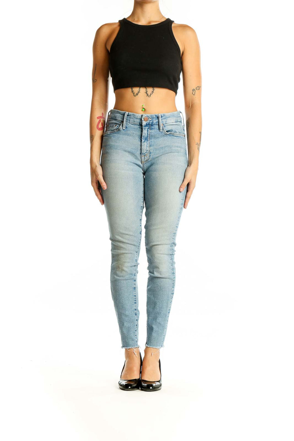 Front view of Mother light blue skinny jeans with raw hem