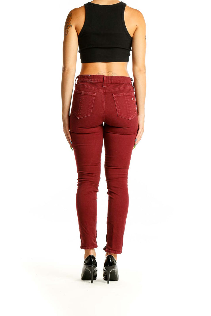 Back view of Rag & Bone burgundy slim-fit denim jeans on model