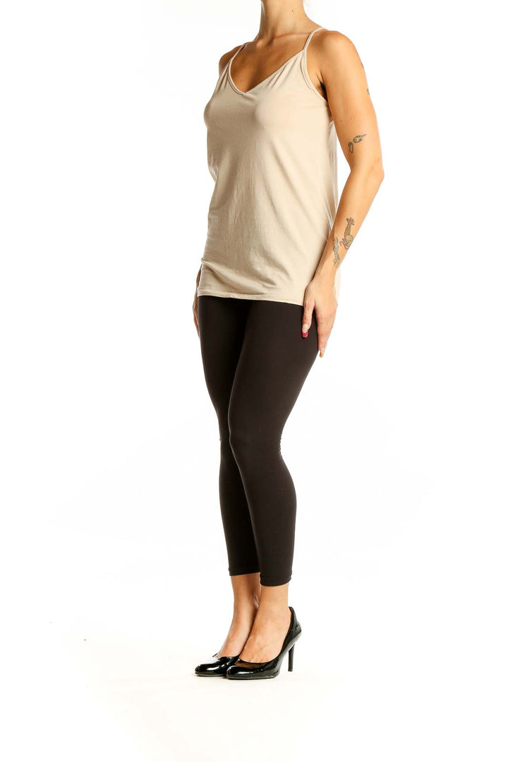 Front view of beige LOFT V-neck camisole top on model