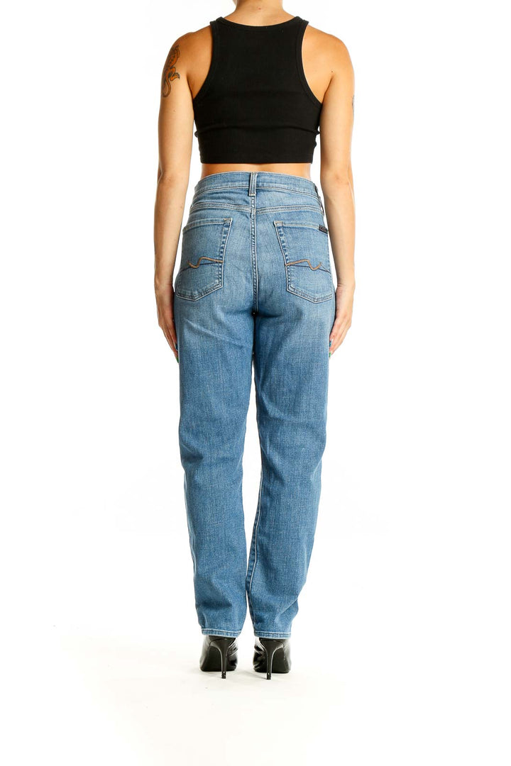 Back view of 7 For All Mankind blue high-waisted straight leg jeans on model