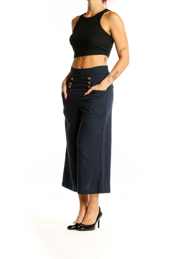 Front view of Unique Vintage navy wide-leg cropped trousers with gold button details