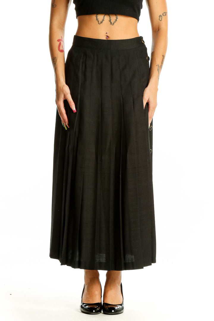 Front view of Pearl C black pleated silk midi skirt on model