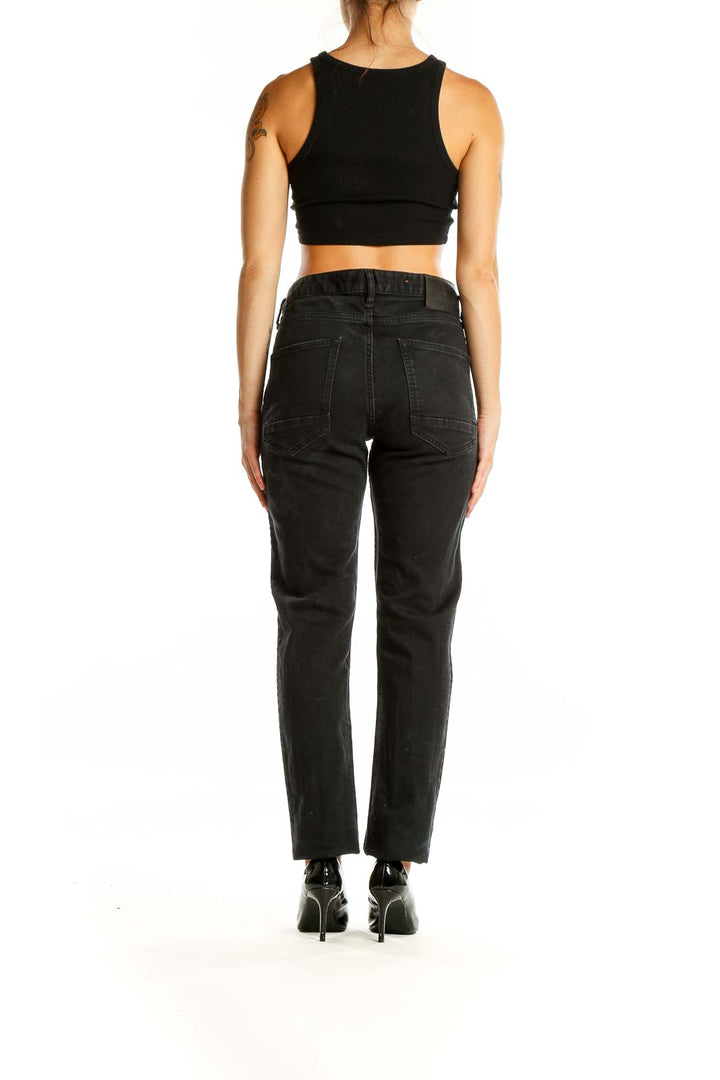 Back view of Scotch & Soda black straight leg jeans on model