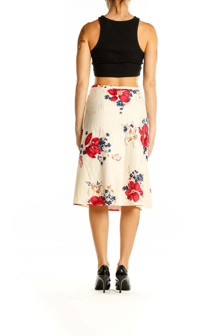 Back view of Ann Taylor LOFT cream floral A-line midi skirt showing pattern continuity