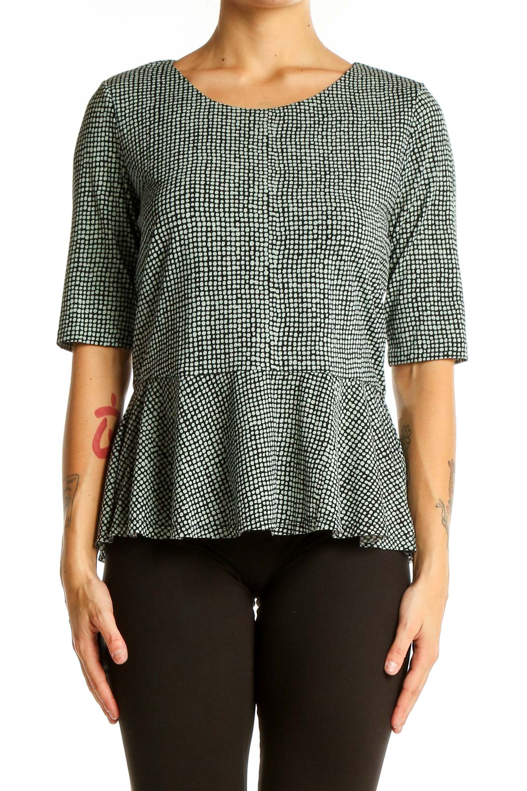 Front view of Vince Camuto green and white geometric patterned peplum top