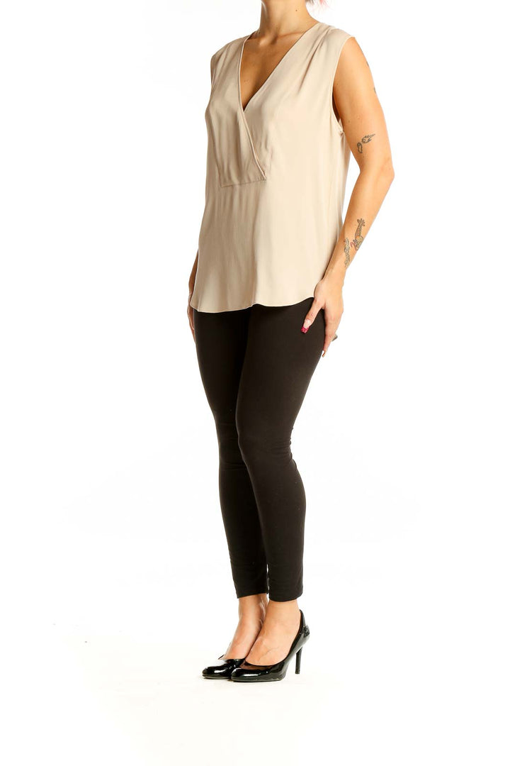 Front view of Theory beige sleeveless silk blouse with V-neck