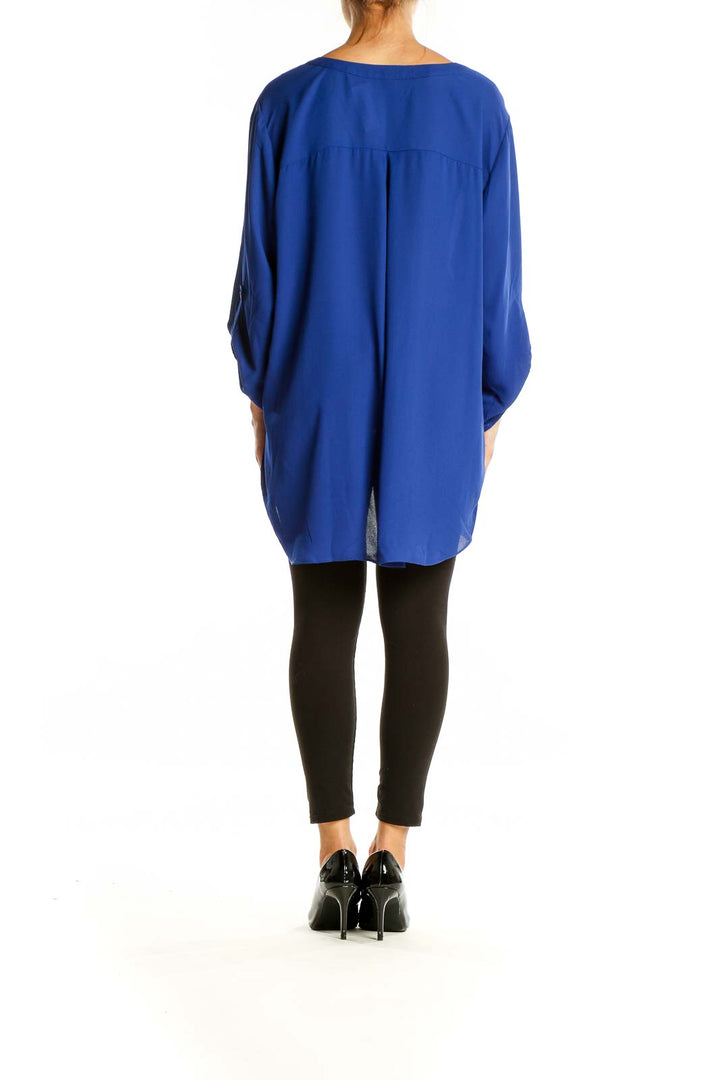 Back view of Vince Camuto royal blue tunic top showing flowy silhouette