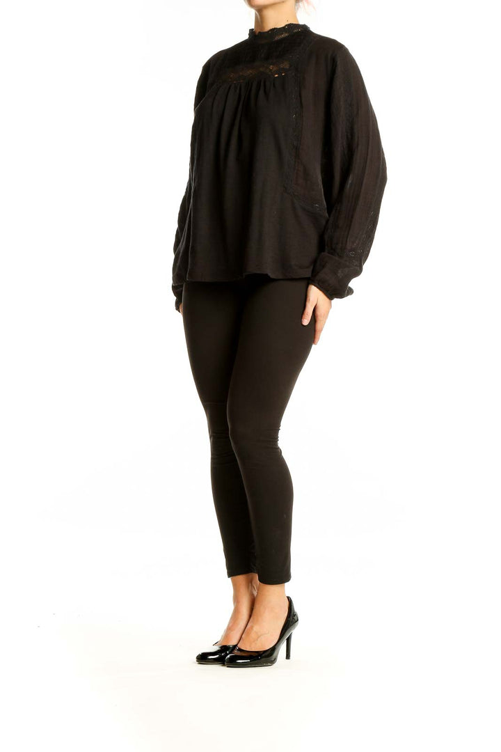 Front view of black Lucky Brand cotton blouse with lace trim and long sleeves