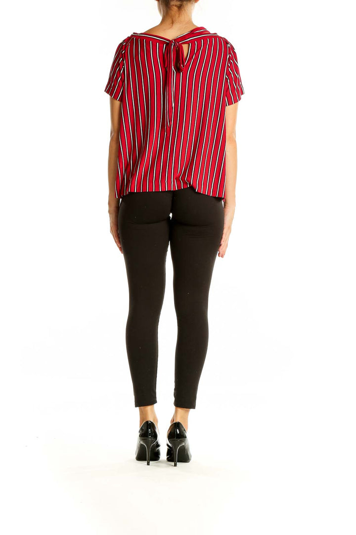 Back view of red striped off-shoulder blouse from LOFT with tie detail