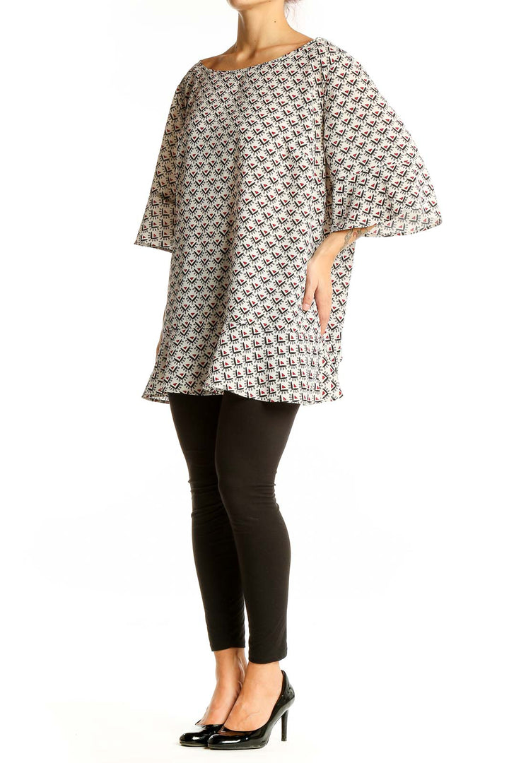 Front view of LOFT white tunic top with black and red geometric print