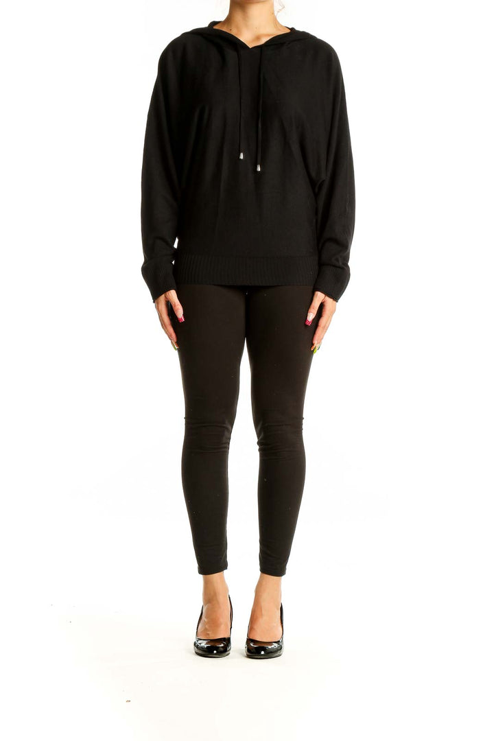 Front view of black hooded top by Cyrus with dolman sleeves