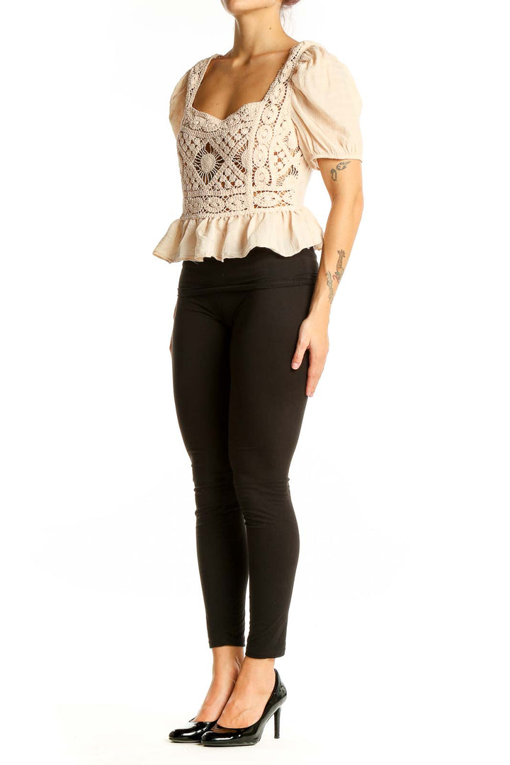 Front view of SilkRoll beige crochet peplum crop top with square neckline and puff sleeves