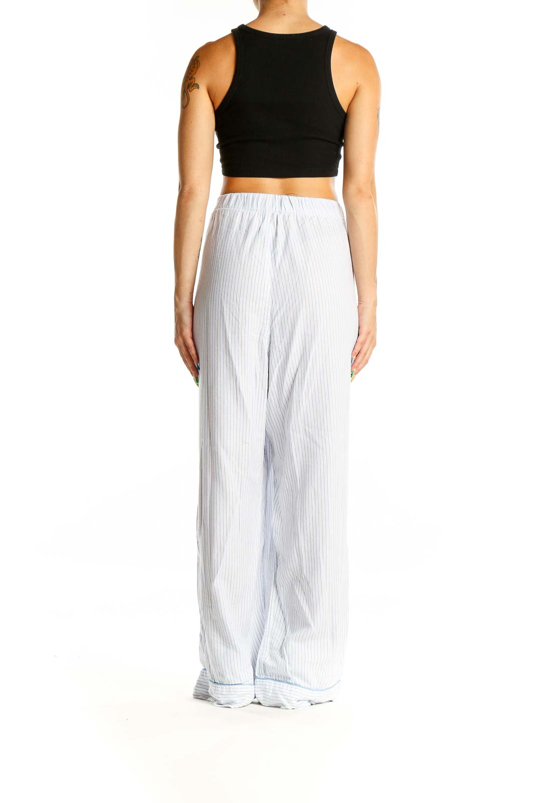 Back view of J.Crew white striped wide-leg pants on model