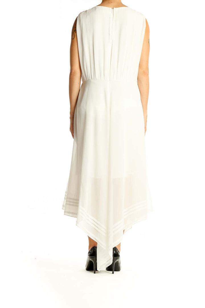 Back view of All Saints white maxi dress showing full length and asymmetrical hem