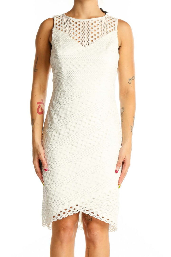 Front view of Guess white lace sleeveless cocktail dress with sheer yoke