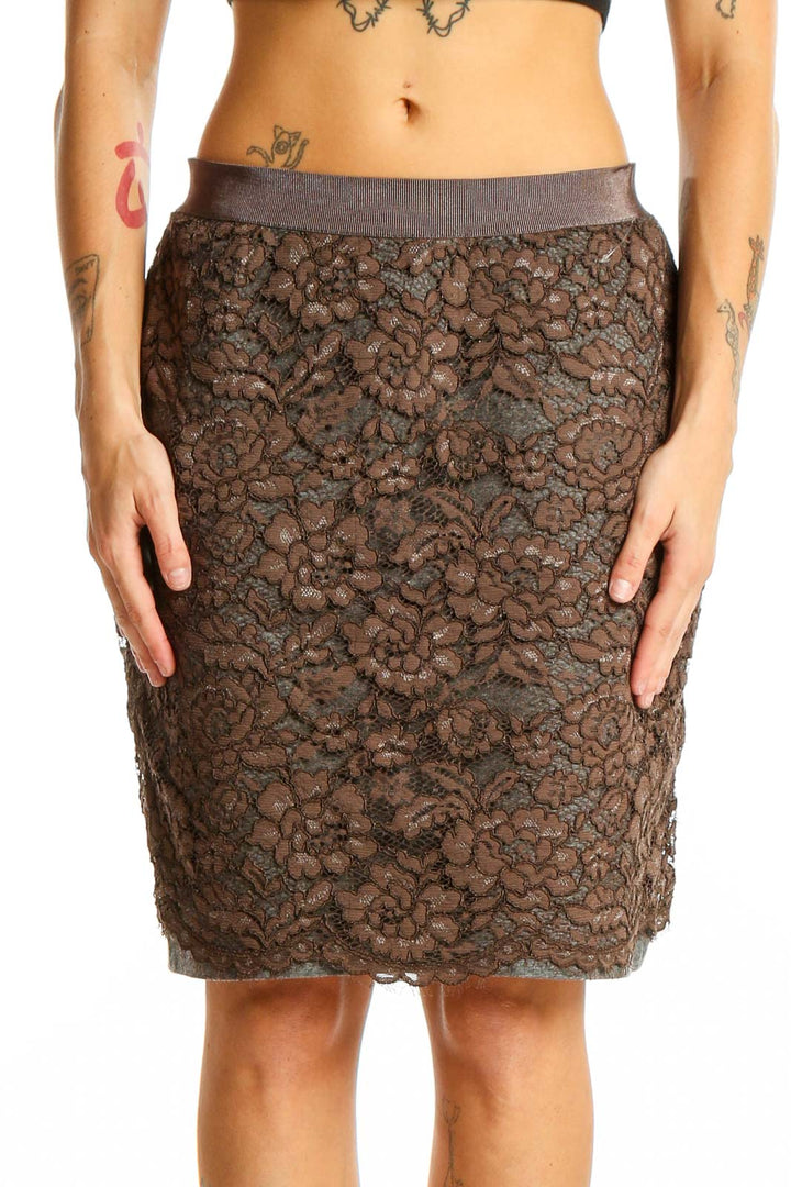 Front view of brown lace pencil skirt by LOFT with floral overlay