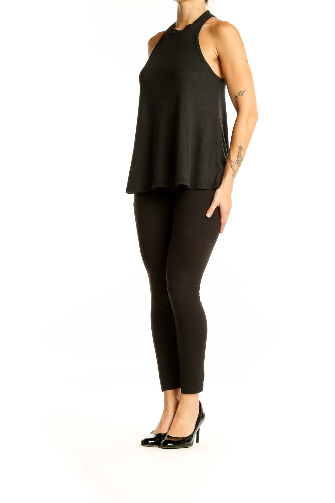 Front view of Free People black ribbed knit sleeveless top with high neck