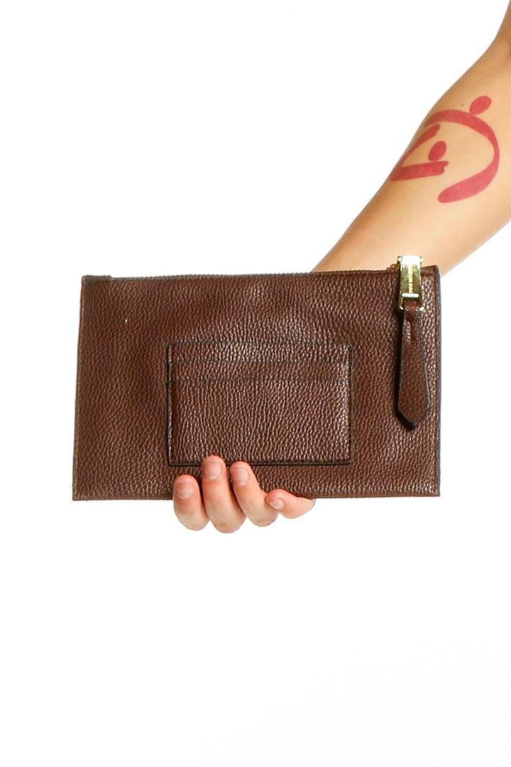 Front view of brown leather zip clutch by London Fog