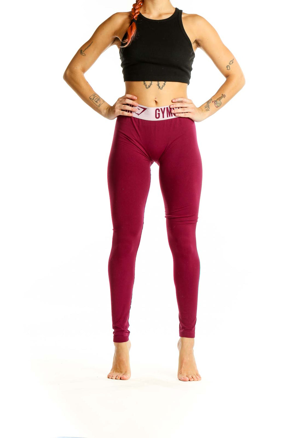 Front view of Gymshark burgundy high-waisted compression leggings