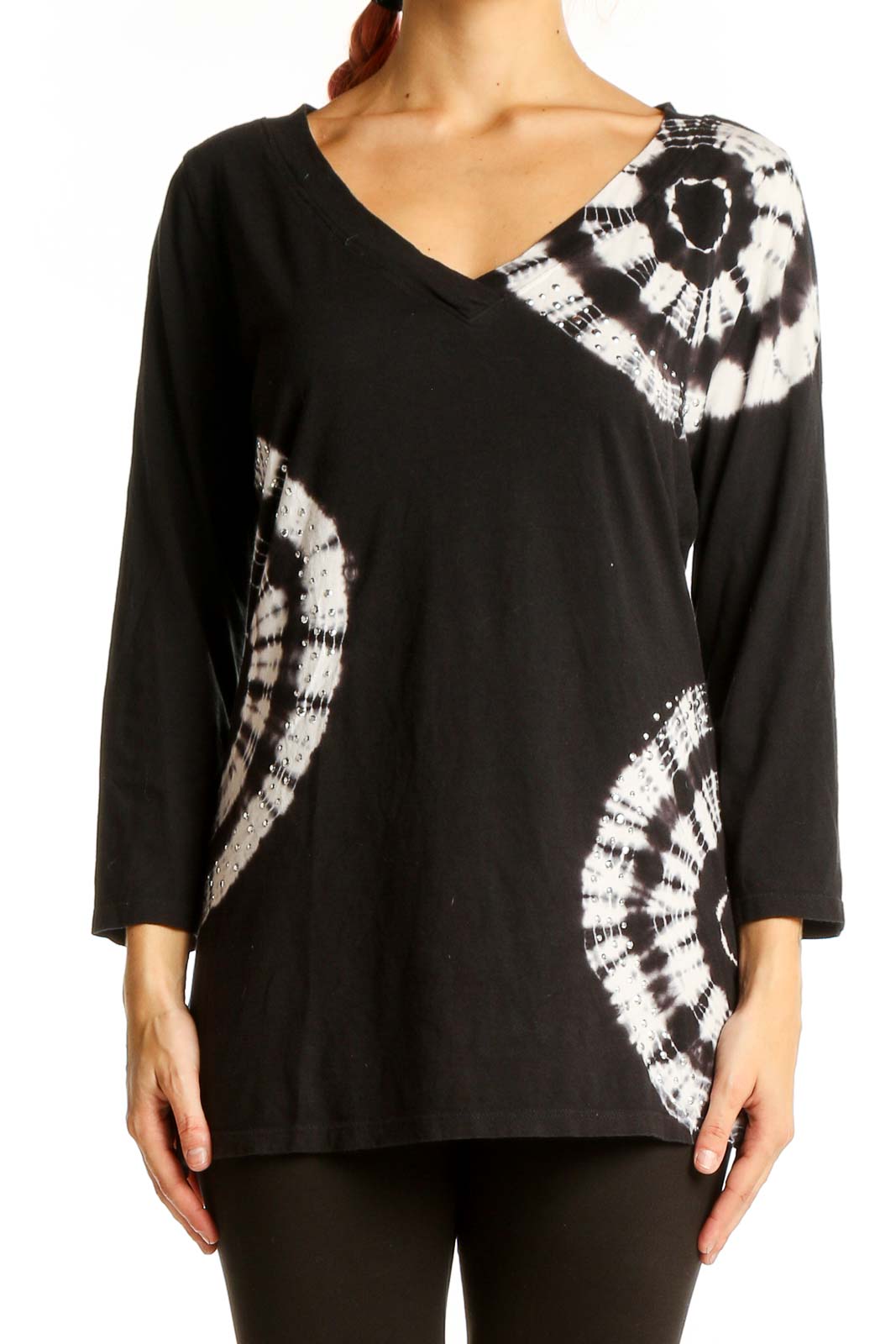 Front view of INC black and white tie-dye V-neck top with circular pattern