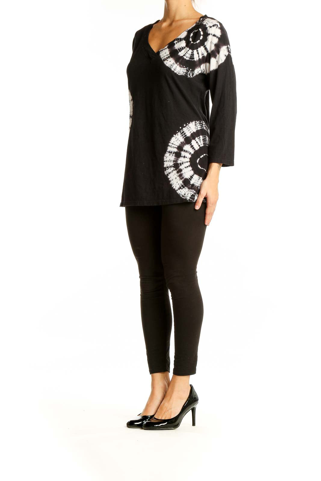 Front view of INC black and white tie-dye V-neck top with circular pattern