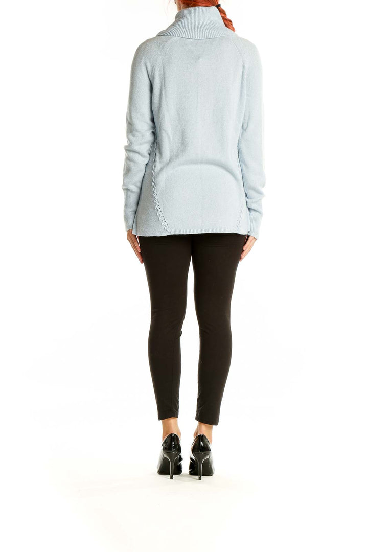 Back view of light blue turtleneck sweater showing full length and fit