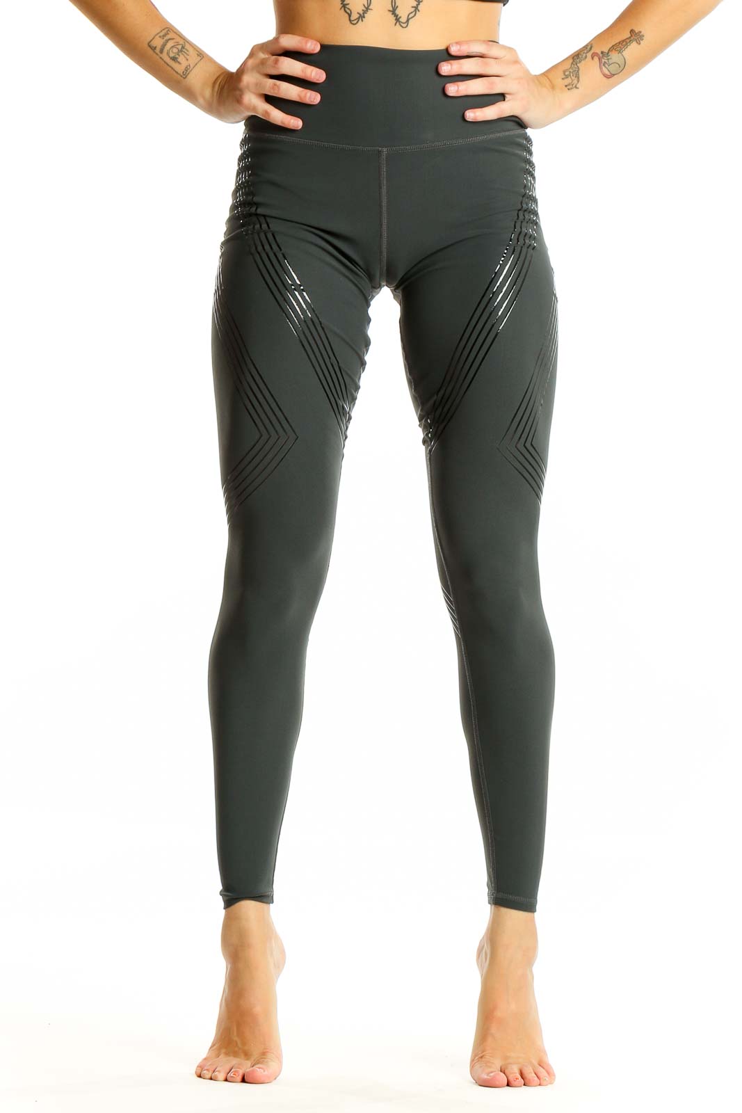 Front view of Alo dark green high-waisted performance leggings with chevron pattern