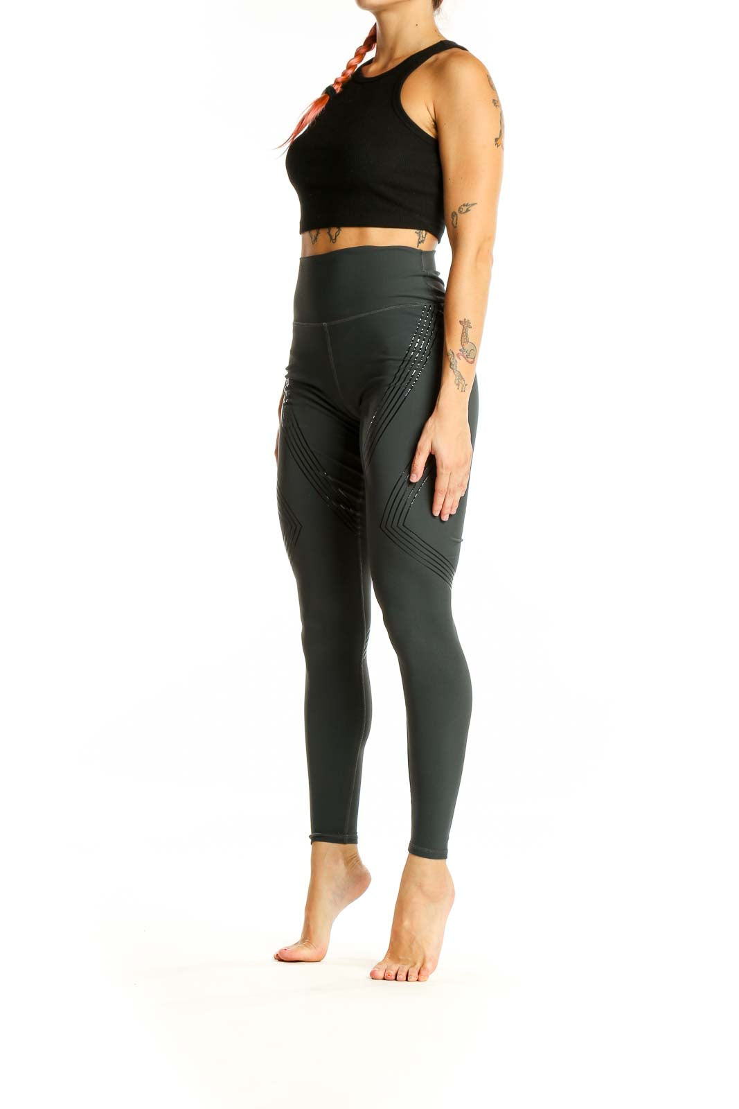 Front view of Alo dark green high-waisted performance leggings with chevron pattern