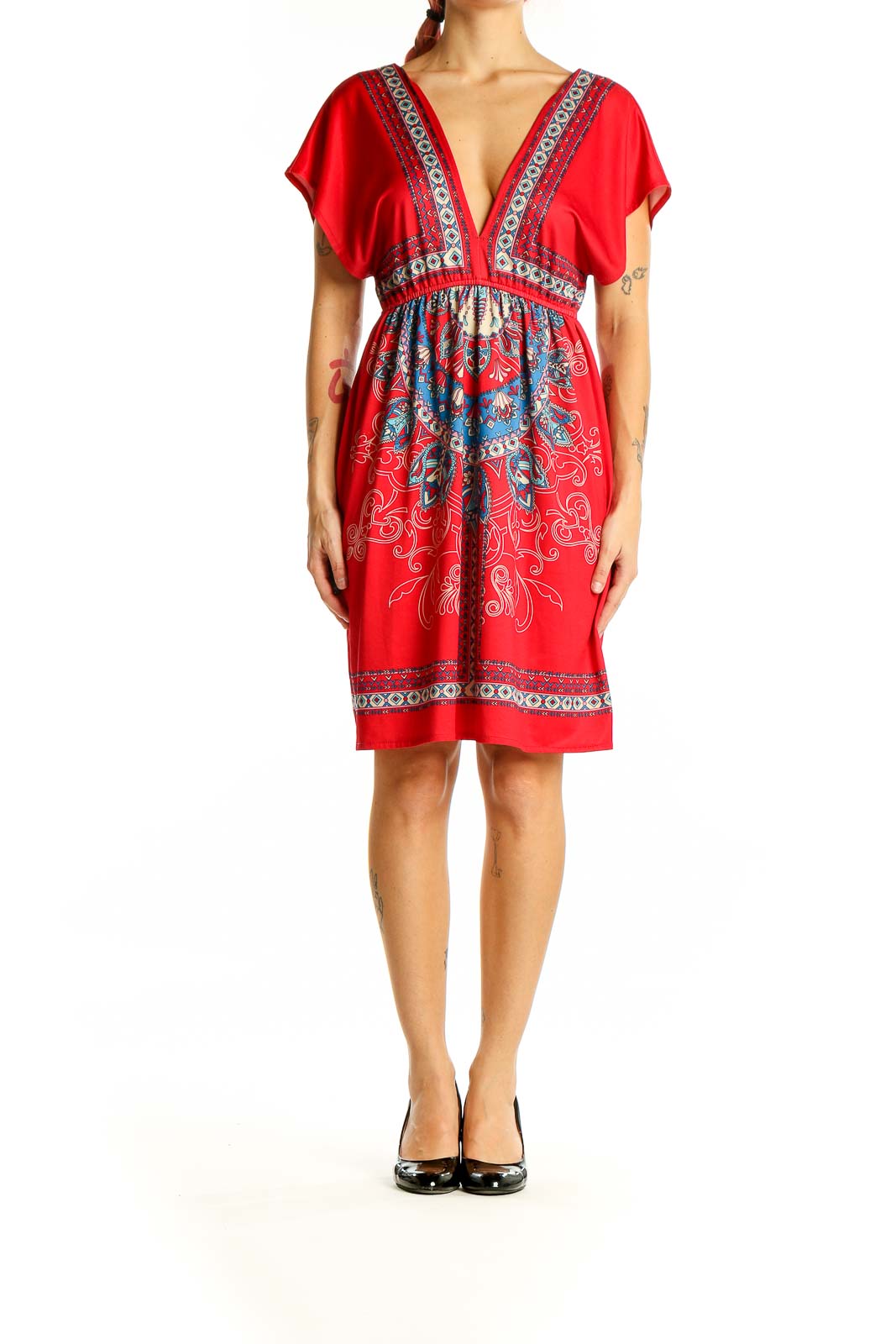 Front view of red bohemian mini dress with embroidered V-neckline and empire waist