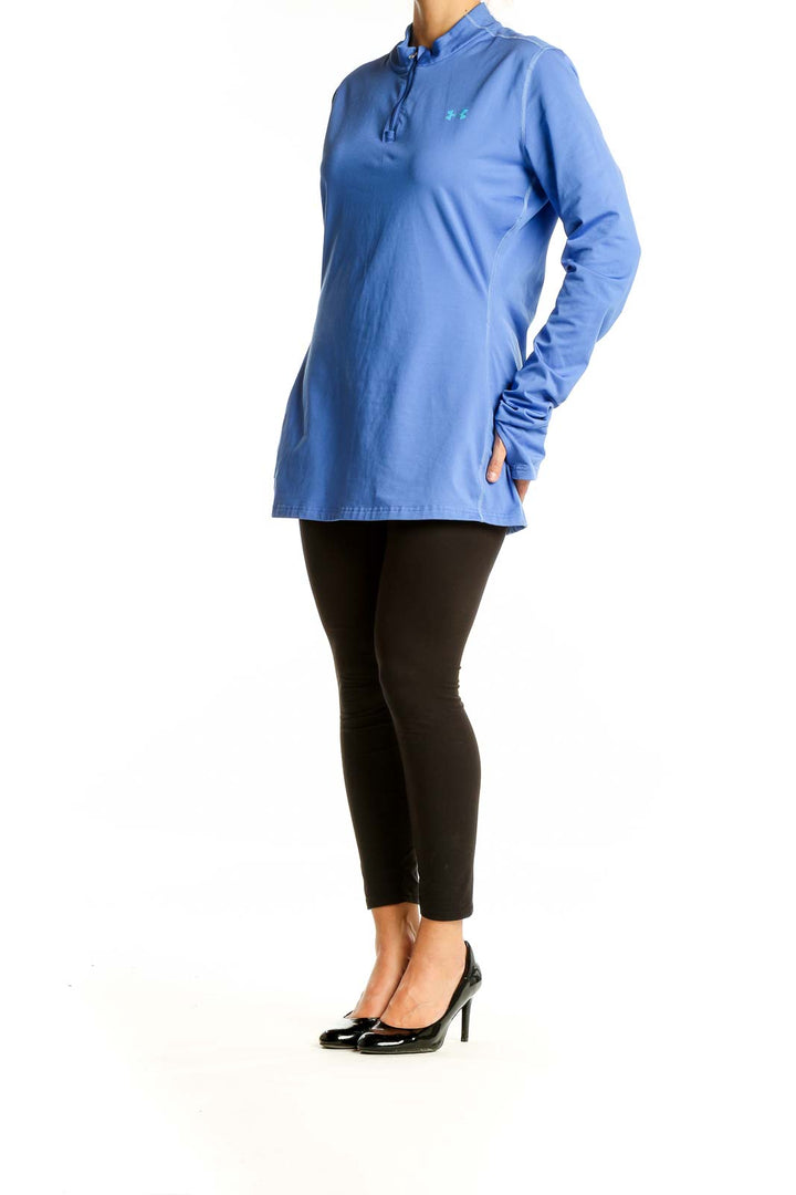 Front view of blue Under Armour quarter-zip athletic top