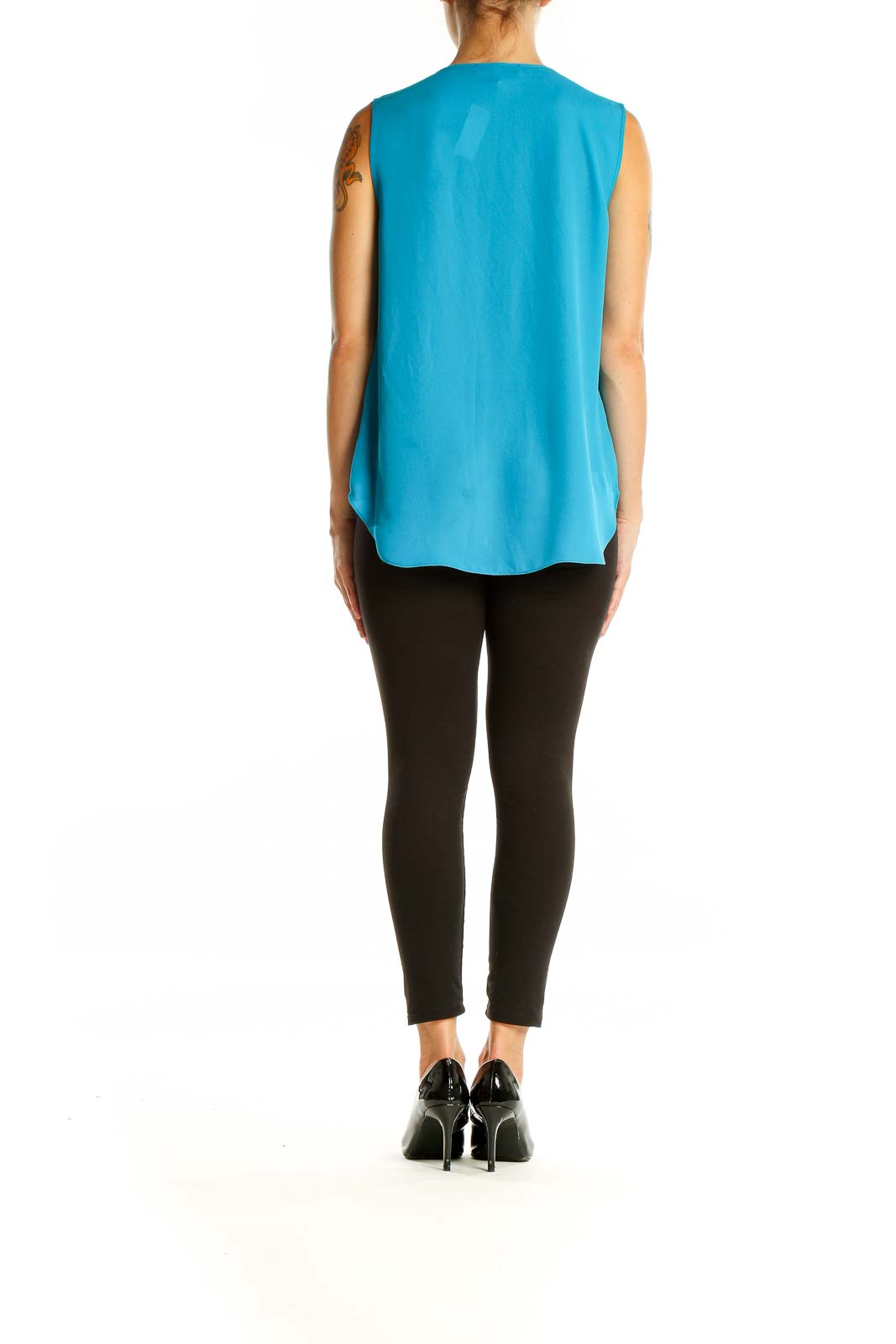 Back view of turquoise sleeveless blouse showing smooth drape