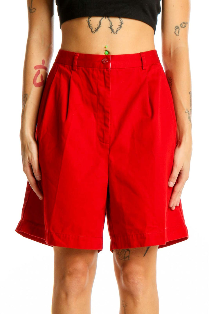 Front view of red Tommy Hilfiger pleated Bermuda shorts