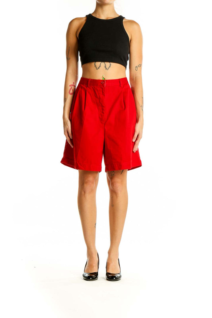 Front view of red Tommy Hilfiger pleated Bermuda shorts