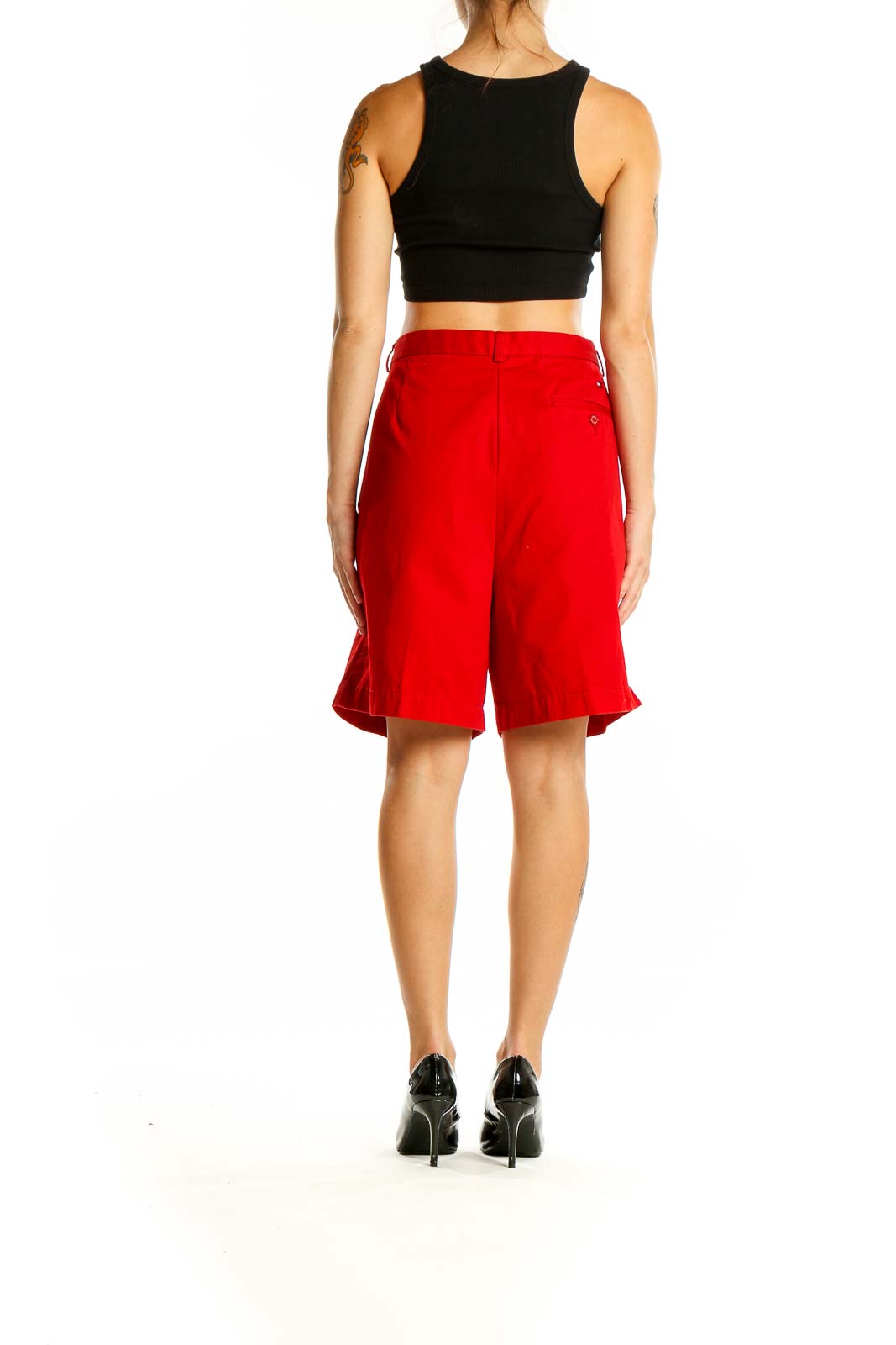 Back view of red Tommy Hilfiger pleated Bermuda shorts on model