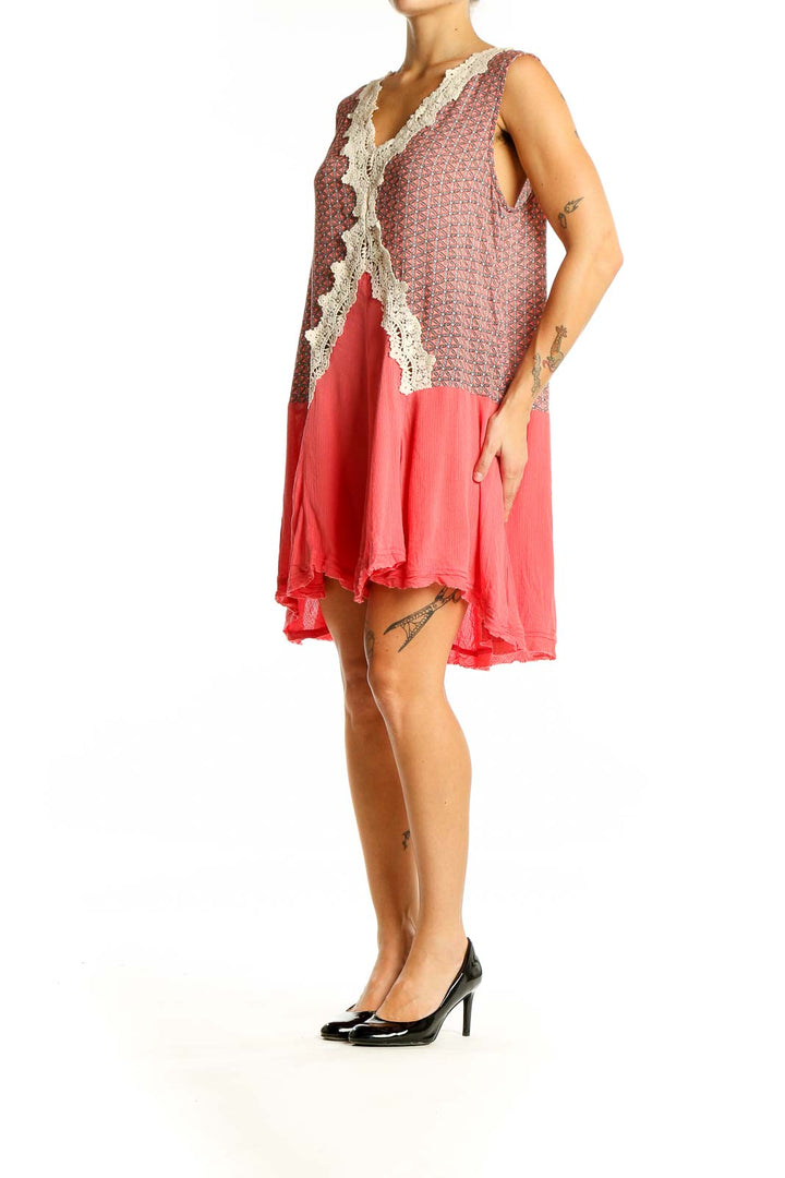 Front view of Umgee coral dress with floral print bodice and lace trim