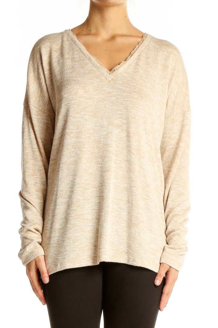 Front view of Doe & Rae beige V-neck sweater with lace trim